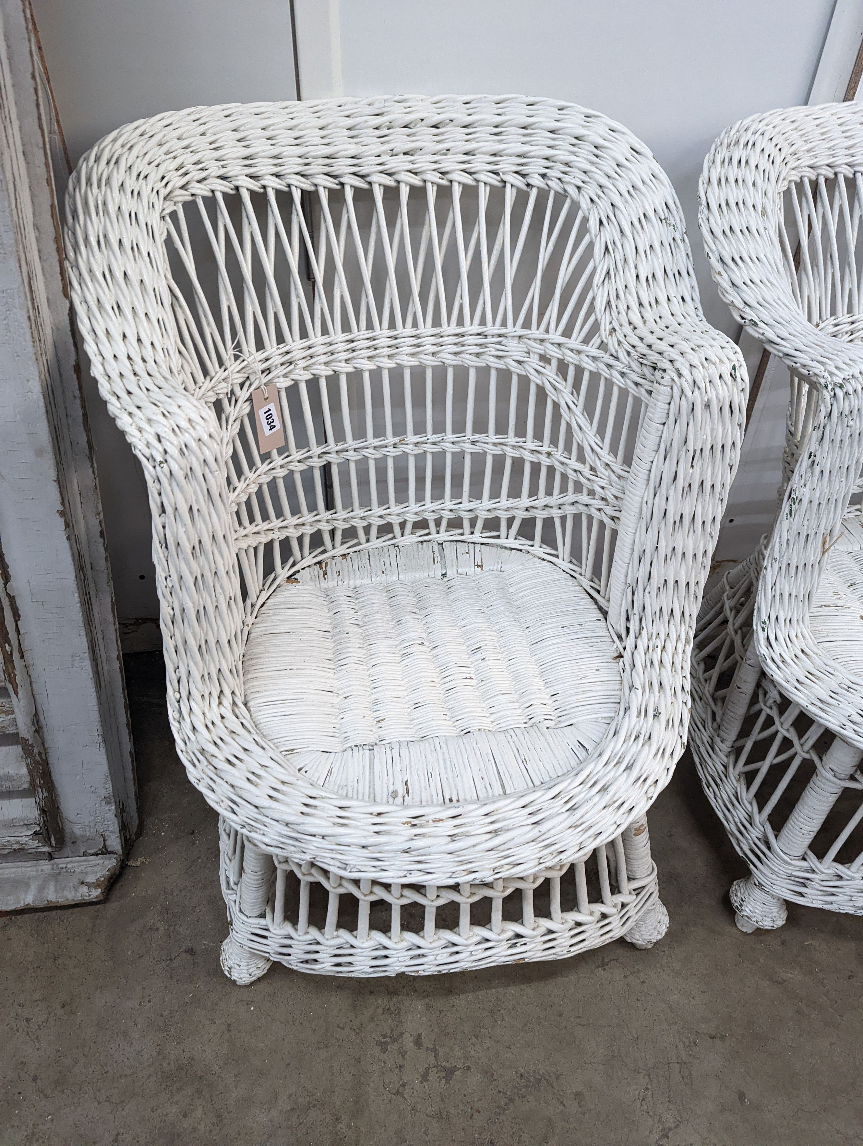 A pair of painted rattan conservatory chairs, width 65cm, height 79cm